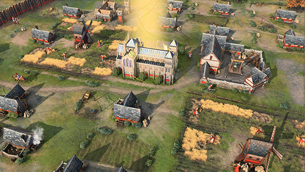 Age of Empires IV oyunundan bir köy görüntüsü.