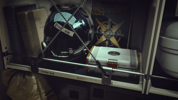 An astronaut helmet and bag standing on the shelf